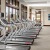 wall of windows brightens spacious fitness center