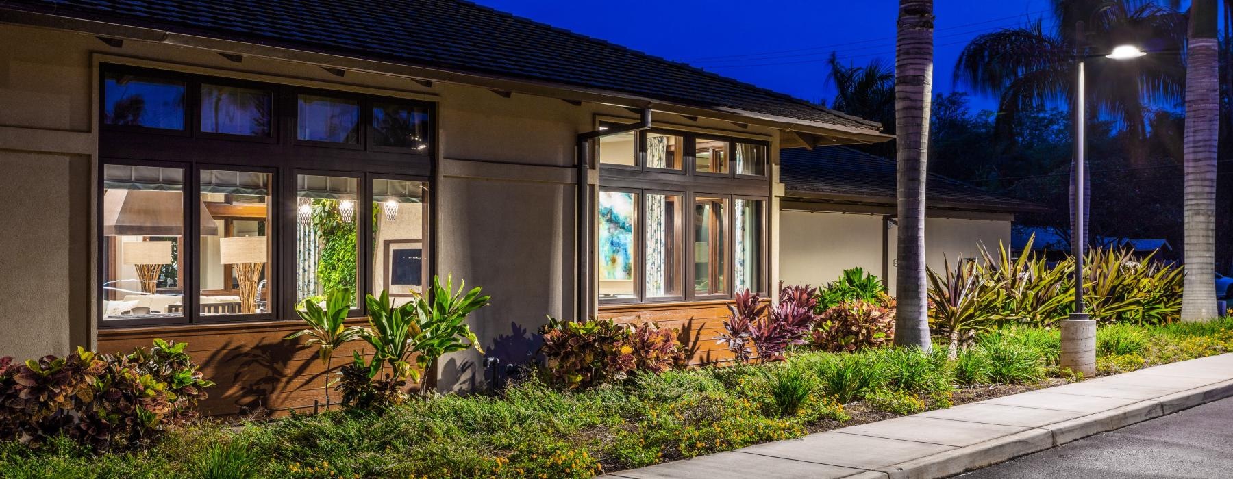 exterior shot of well lit clubhouse at night